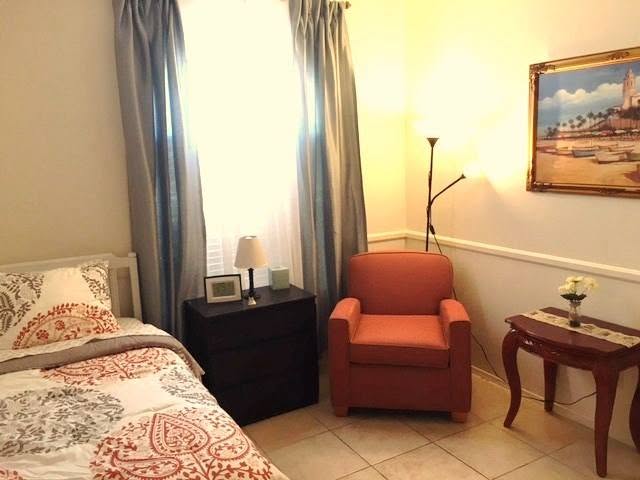 Bedroom with a bed and armchair at Azure Care Home